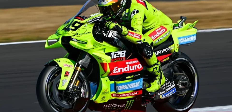 Motorcyclist racing on a bright green bike
