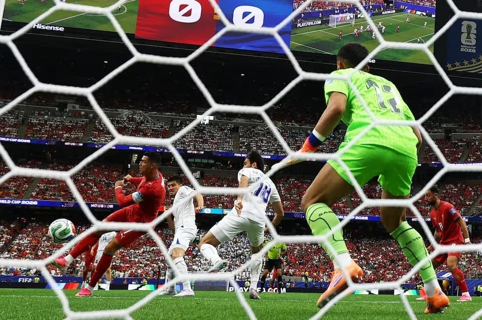Goalkeeper preparing to save a shot during match Goalkeeper preparing to save a shot during match
