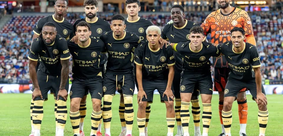 Football team posing for photo before match