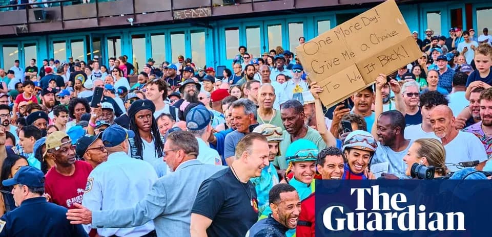 Crowd at event holding sign requesting another chance