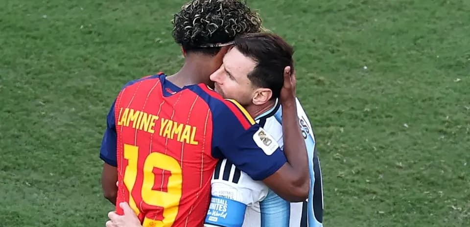 Two players embracing on the football field