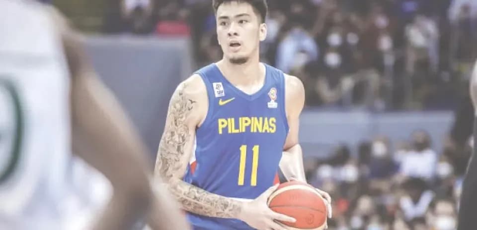Basketball player holding ball during game