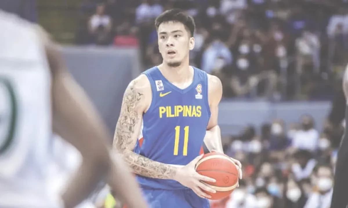 Basketball player holding ball during game