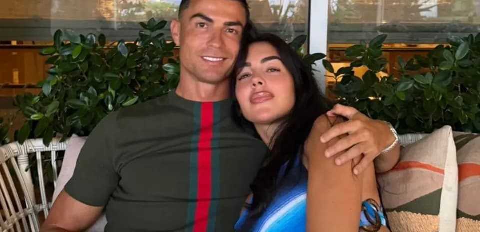 Couple posing together on a sofa