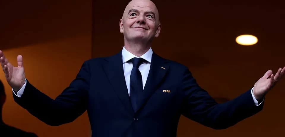 FIFA official gesturing from a viewing box