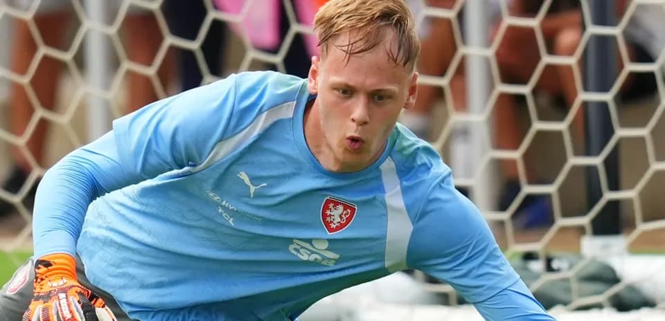 Goalkeeper diving to save the ball during training