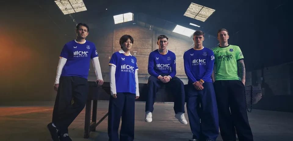 Everton players showcasing new team kits indoors