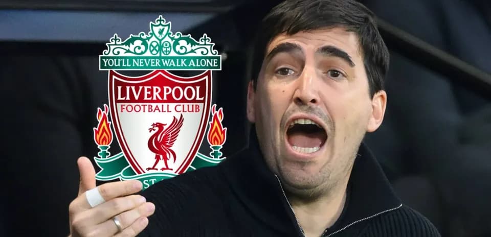 Shouting coach in front of Liverpool logo
