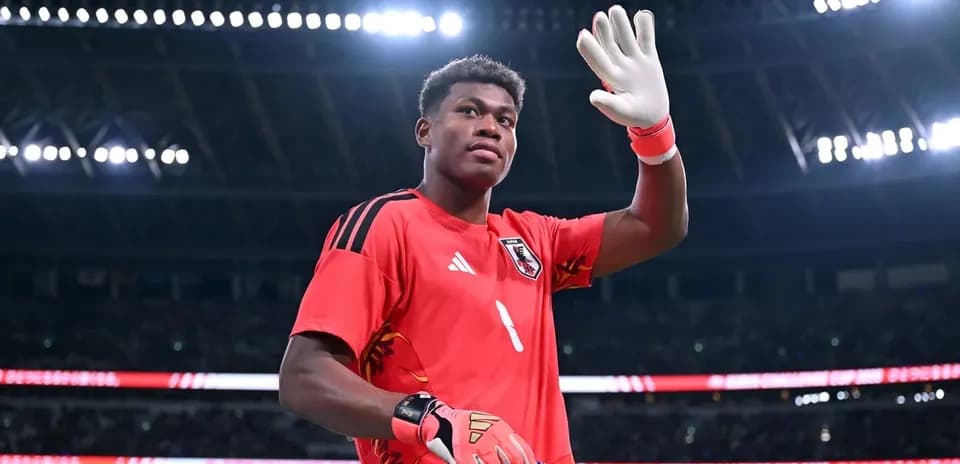 Goalkeeper waving during match at stadium