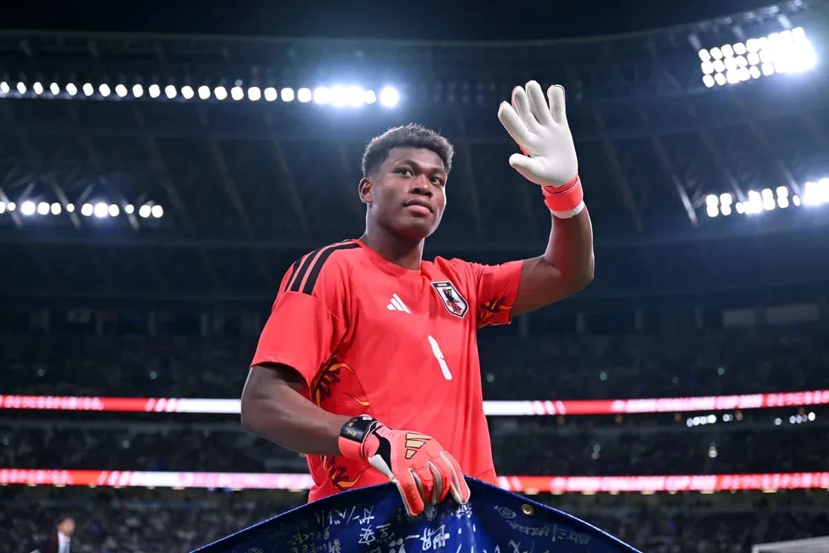 Goalkeeper waving during match at stadium