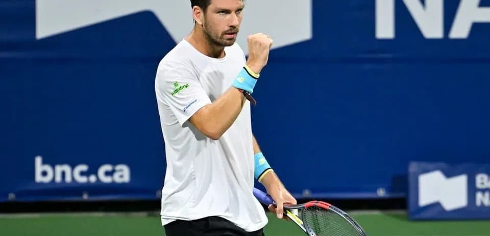 Tennis player celebrating on the court
