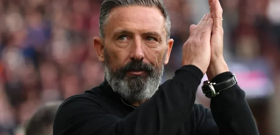 Coach applauding during a football match