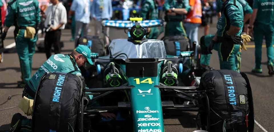 Aston Martin team preparing car on the grid