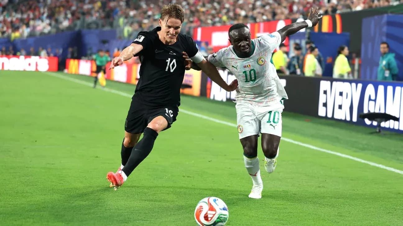 Two players competing for the ball on field