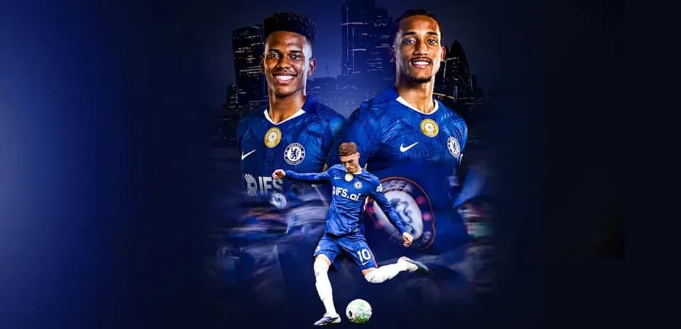 Chelsea players posing in team kits with ball