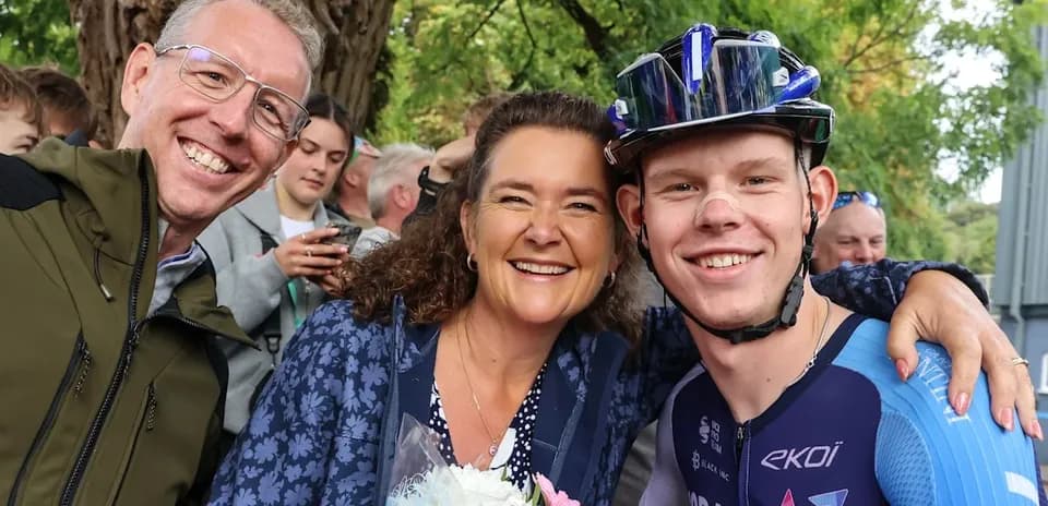Cyclist posing with supporters after an event