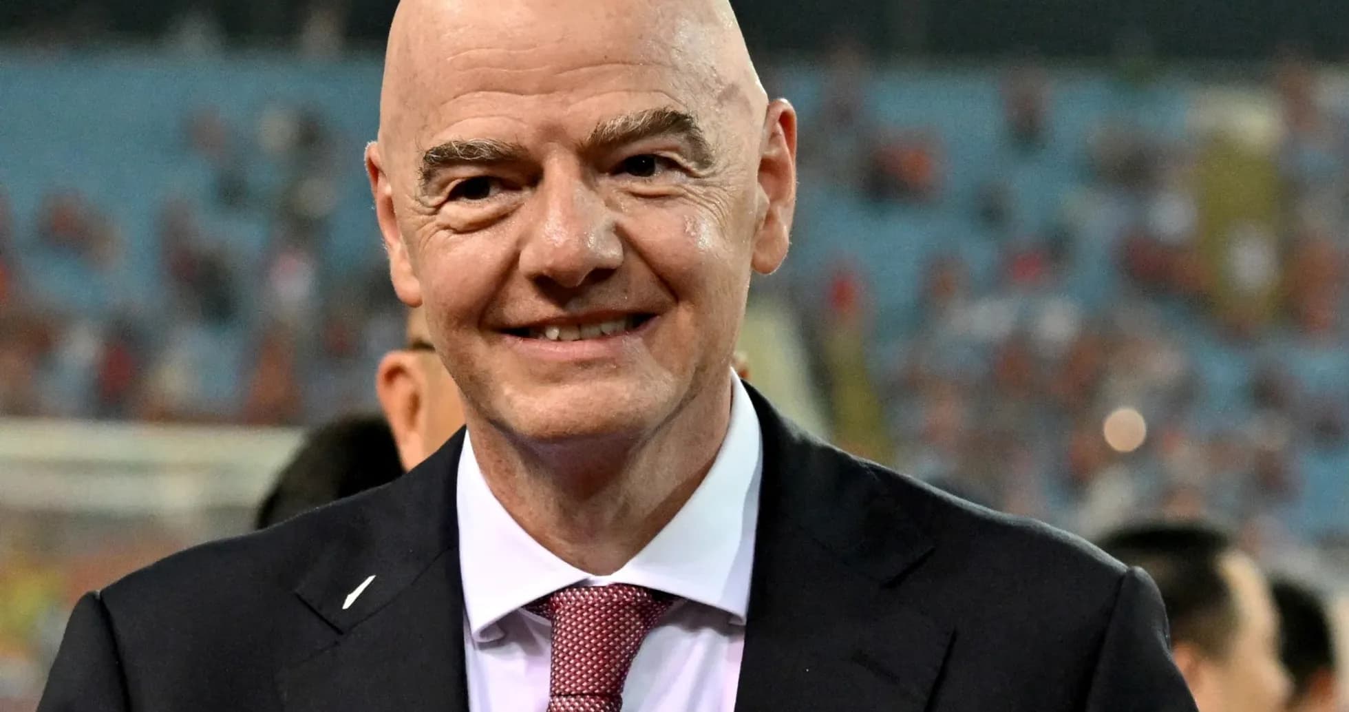 FIFA president smiling at stadium event