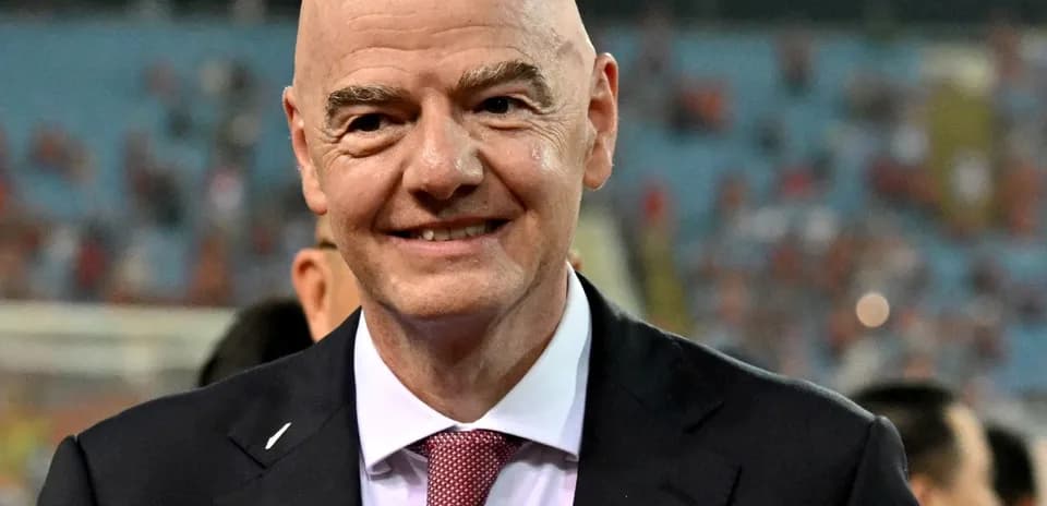 FIFA president smiling at stadium event