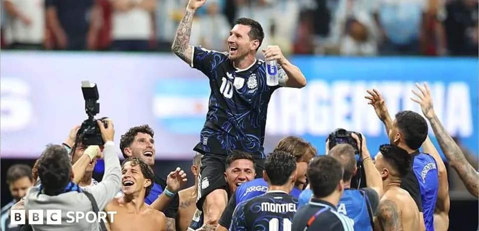 Argentina players celebrating with Lionel Messi after victory