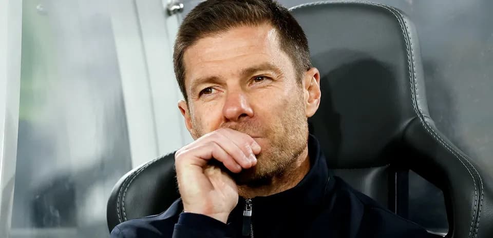 Coach sitting on bench during a match