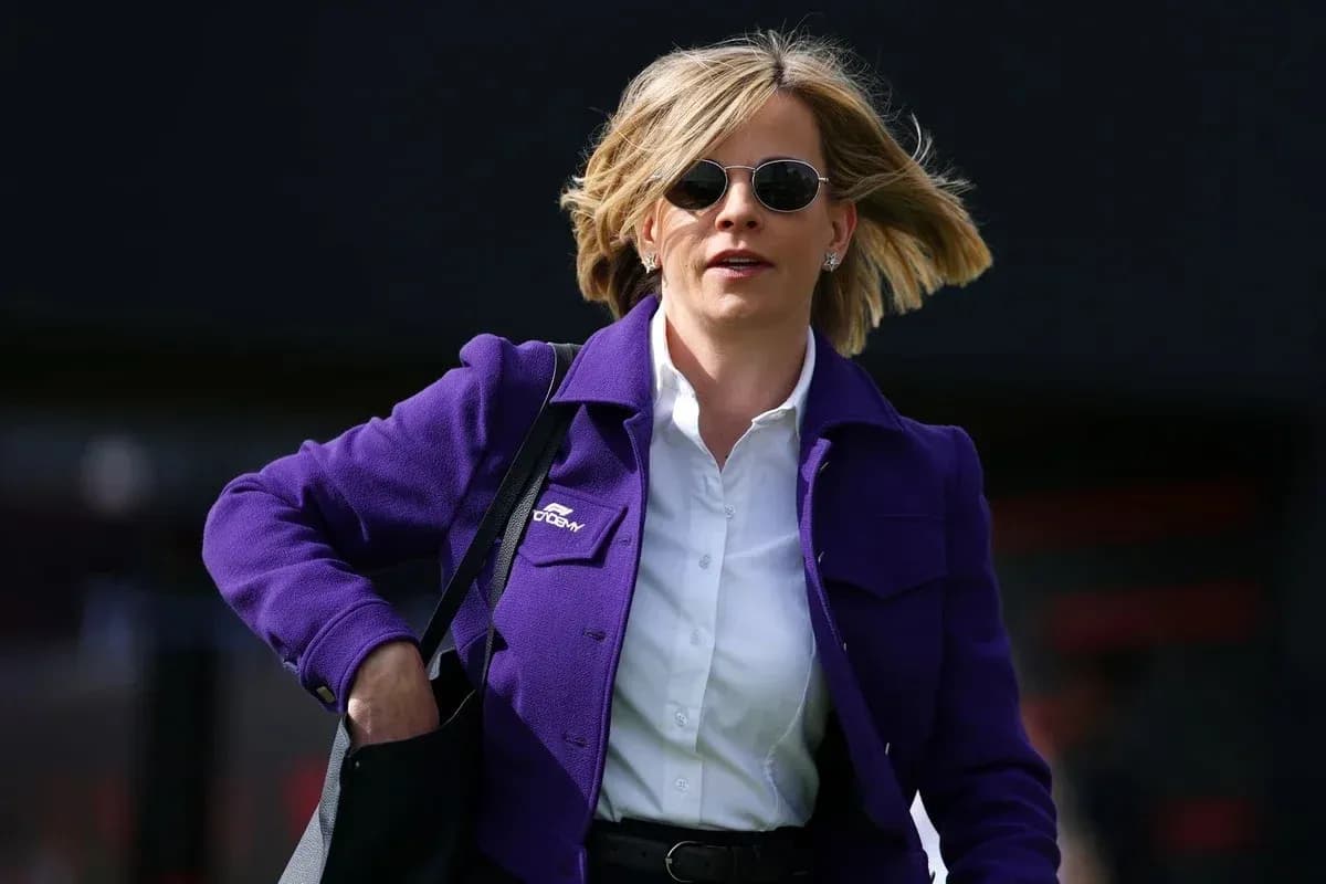 Woman in purple jacket walking with a bag