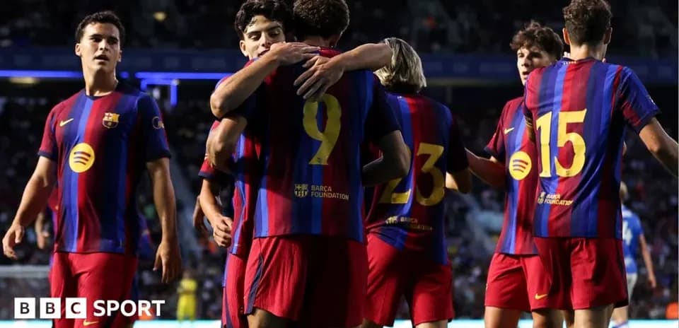 Barcelona players celebrating a goal on the field