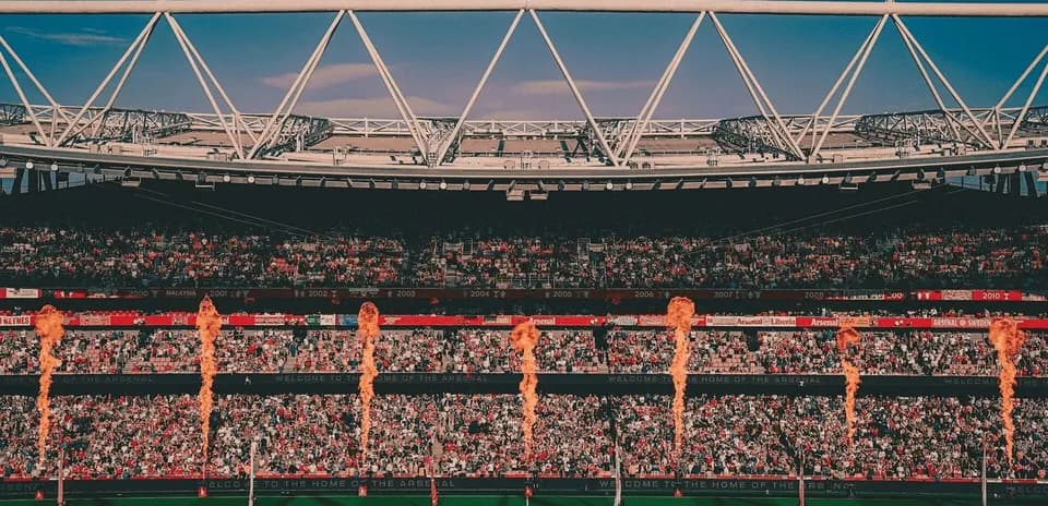Stadium filled with fans and pyrotechnics display