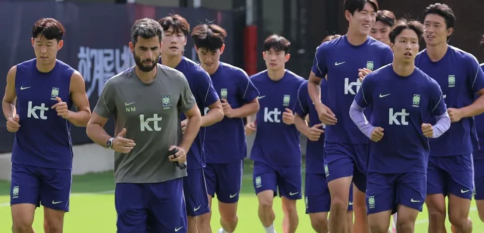 Korean football team jogging during training session