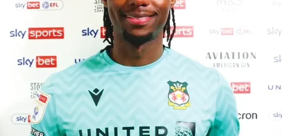 Goalkeeper posing in club kit for photo