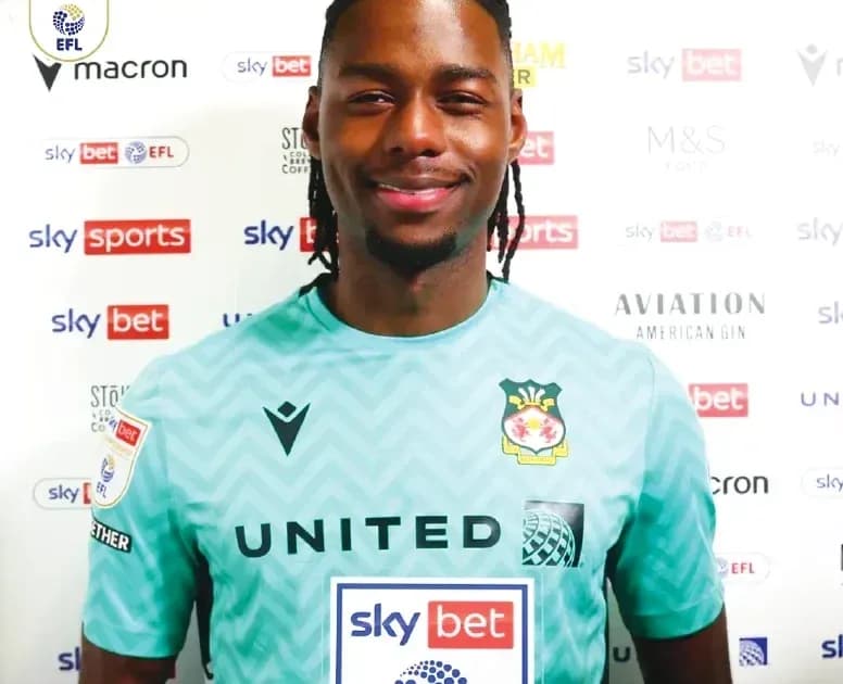 Goalkeeper posing in club kit for photo