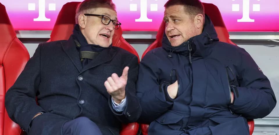 Two men chatting in team bench seats