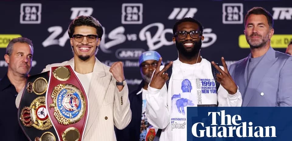 Boxers posing with championship belts at press conference