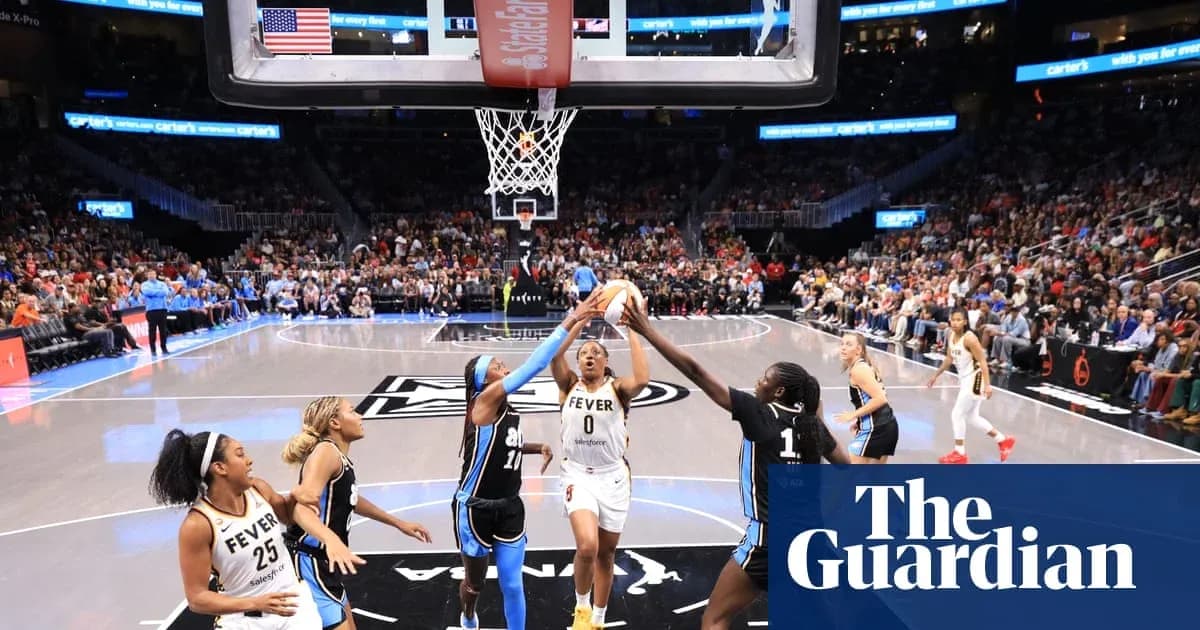 Basketball players competing for the ball near hoop