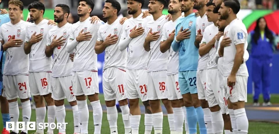 Iran national team standing for national anthem