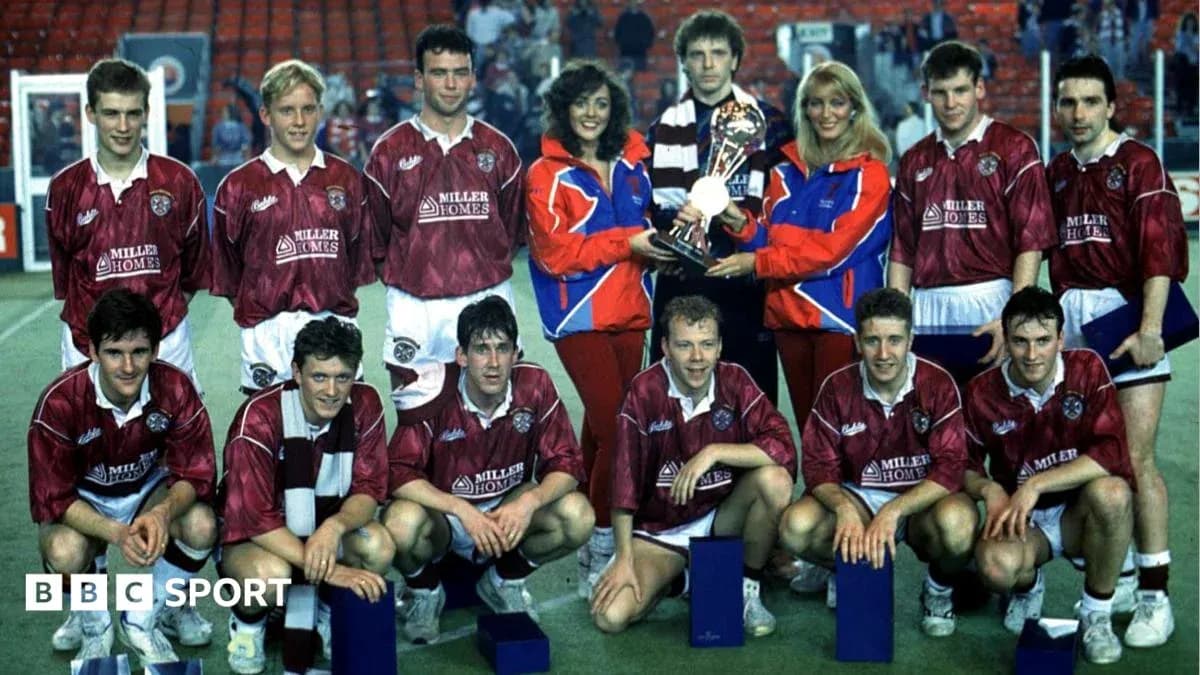 Football team posing with trophy and awards