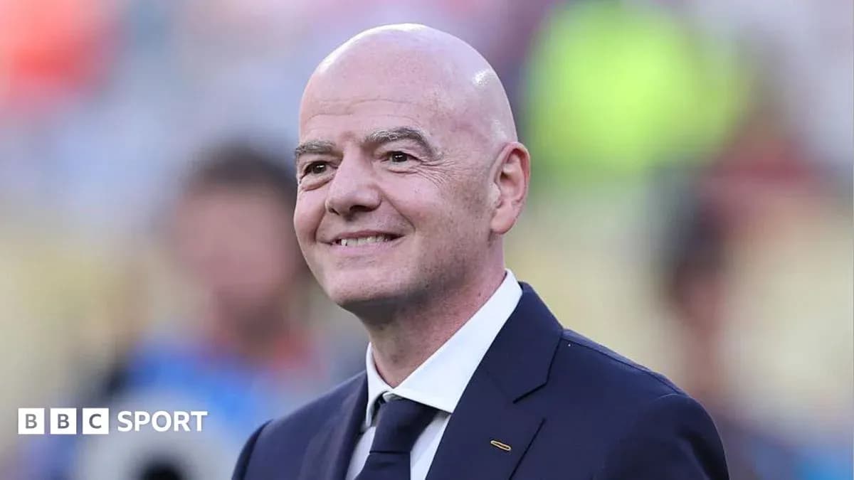 FIFA president smiling at an event FIFA president smiling at an event