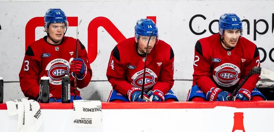 Montreal Canadiens players sitting on bench during game