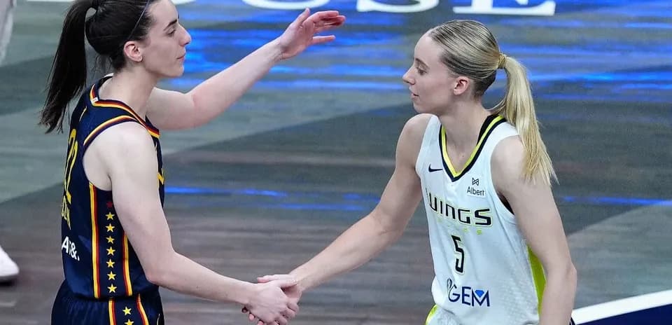 Two basketball players shaking hands post-game