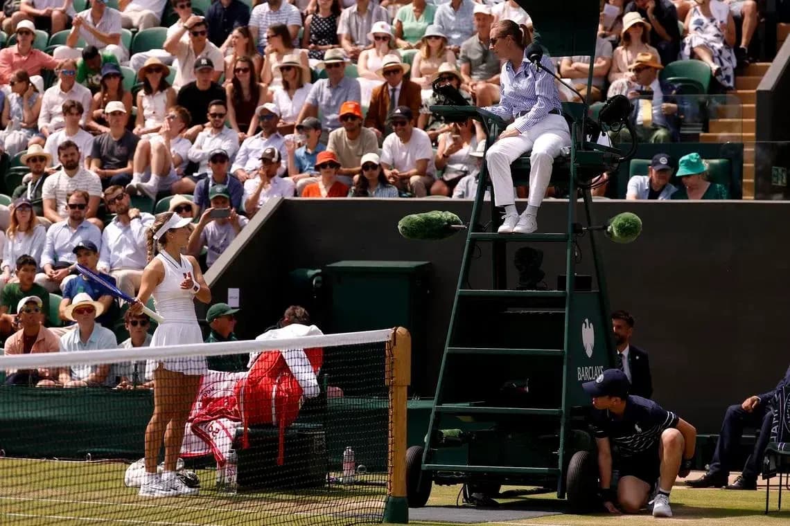 Tennis player preparing to serve during match