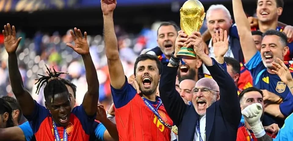 Spain team celebrating with FIFA World Cup trophy