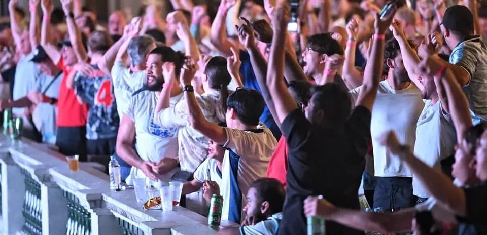 Fan crowd celebrating during a sports event