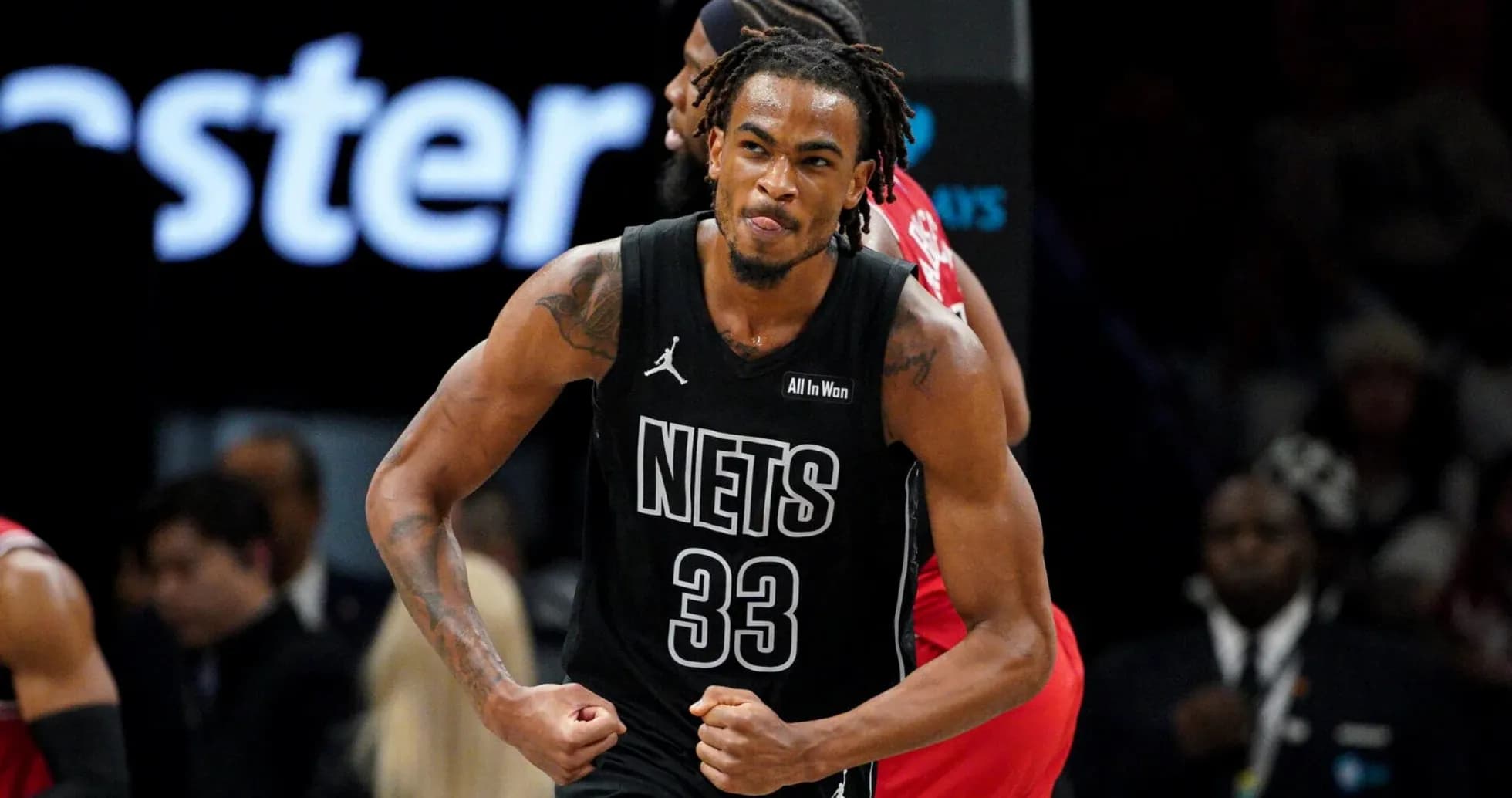 Basketball player celebrating after scoring for Nets