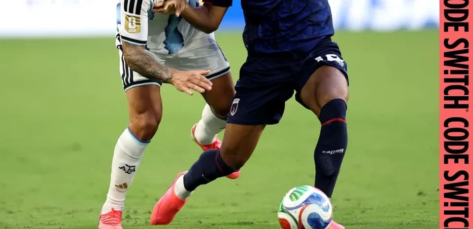 Two players competing for the ball on field