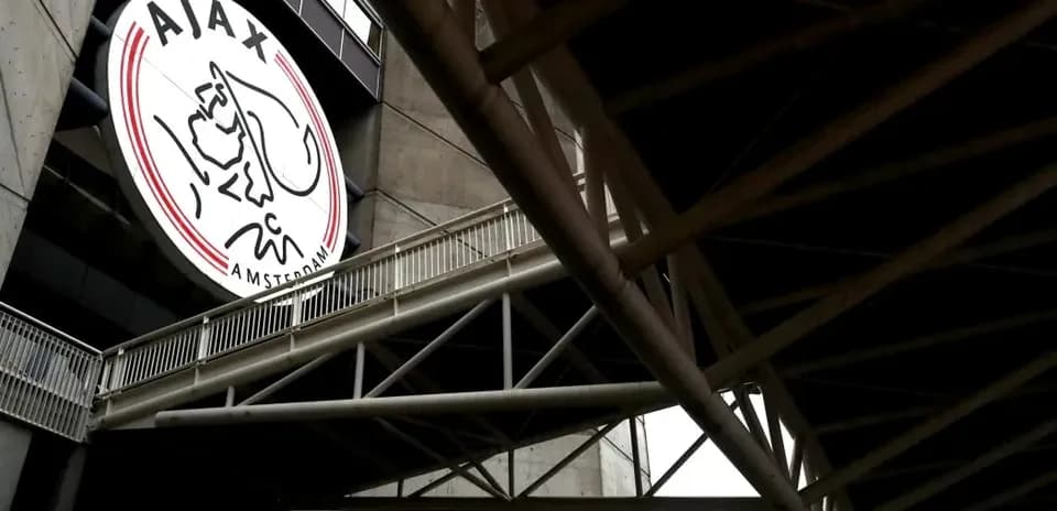 Ajax Amsterdam logo on stadium exterior