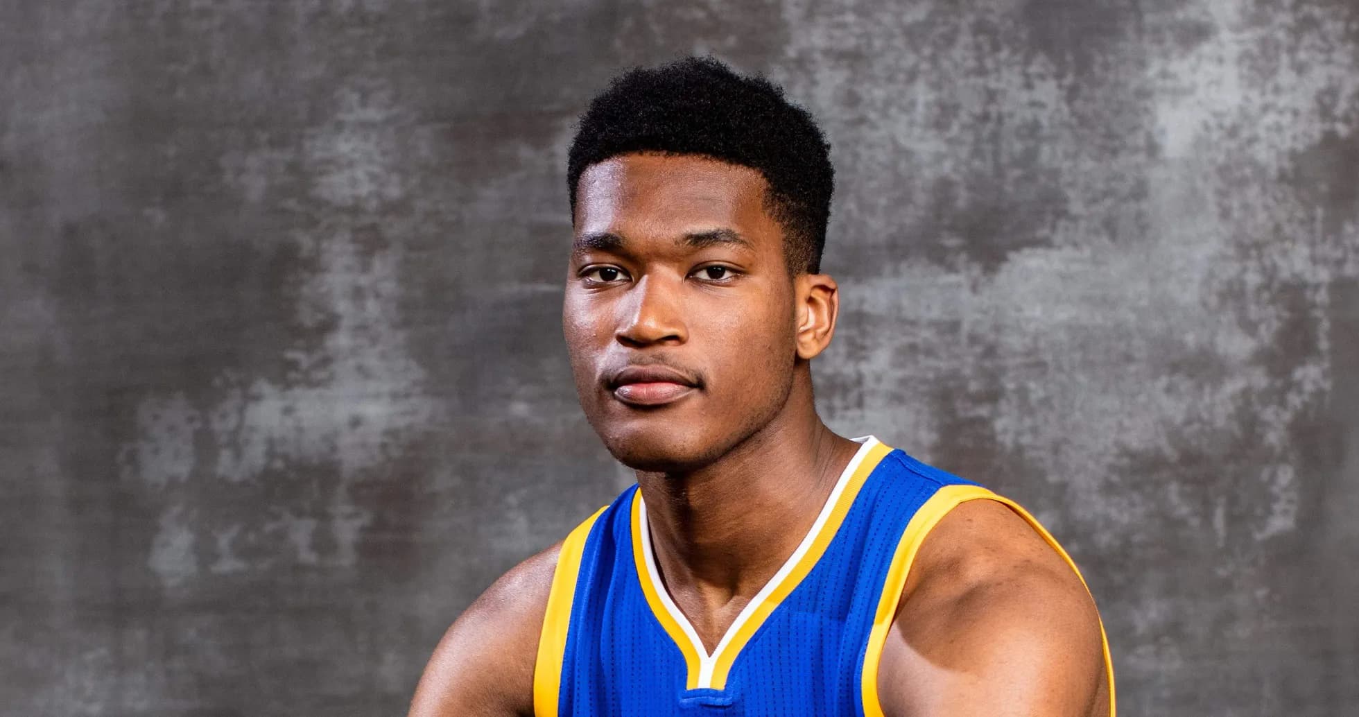 Basketball player posing in team jersey