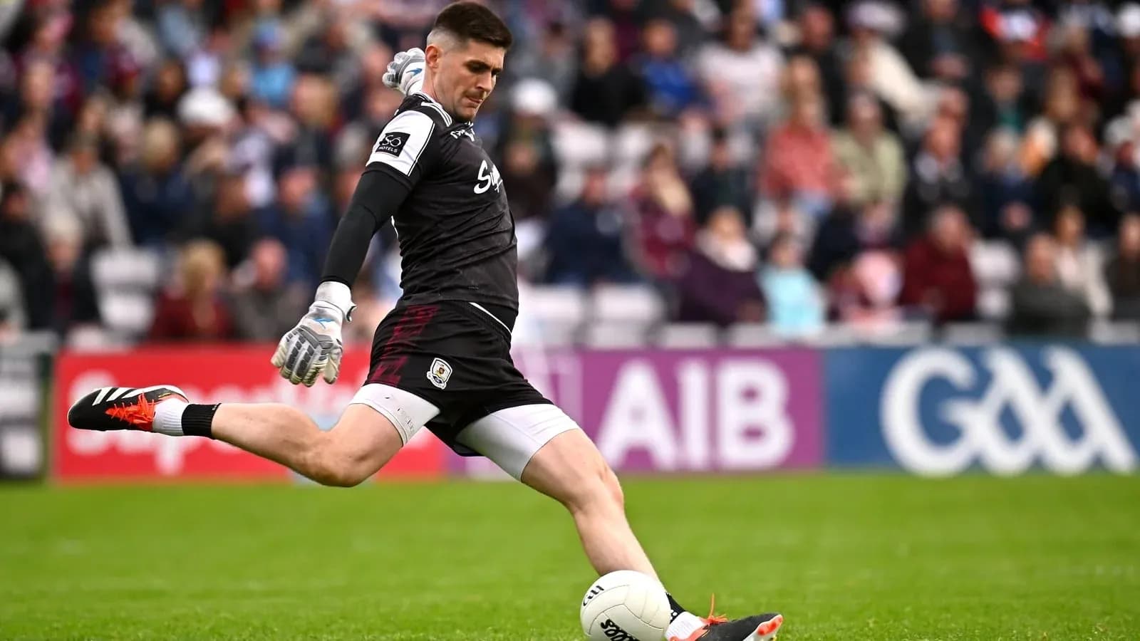 Goalkeeper kicking the ball during a match Goalkeeper kicking the ball during a match