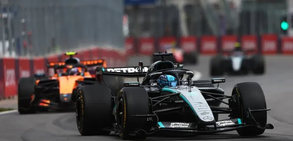 Mercedes car leading McLaren during Formula 1 race