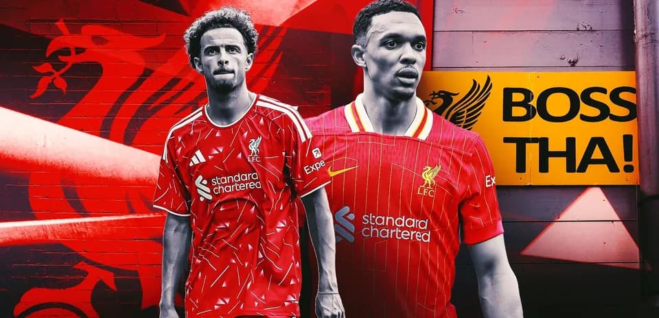 Liverpool players posing in red kits with logo