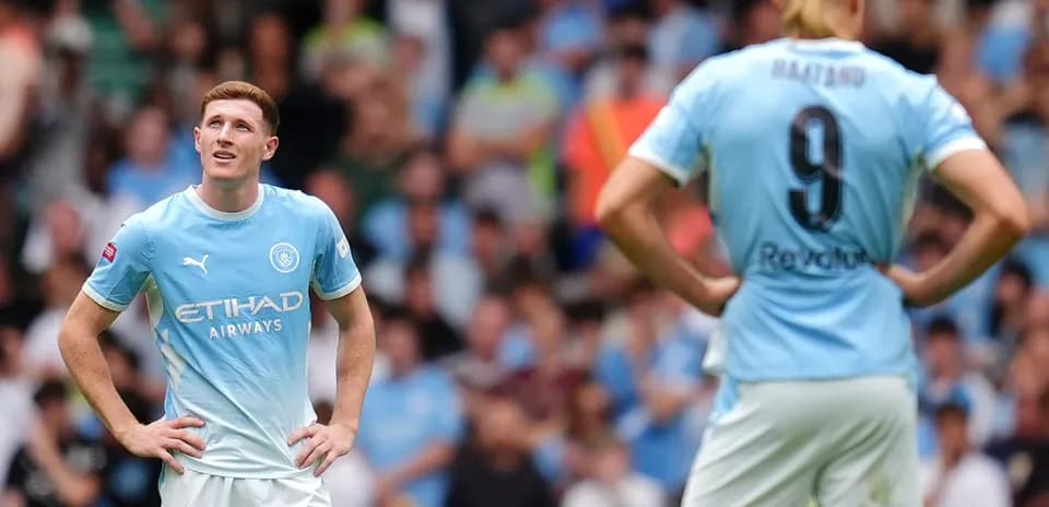 Manchester City players observing the game during match