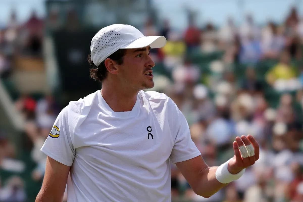 Tennis player gesturing during match on court
